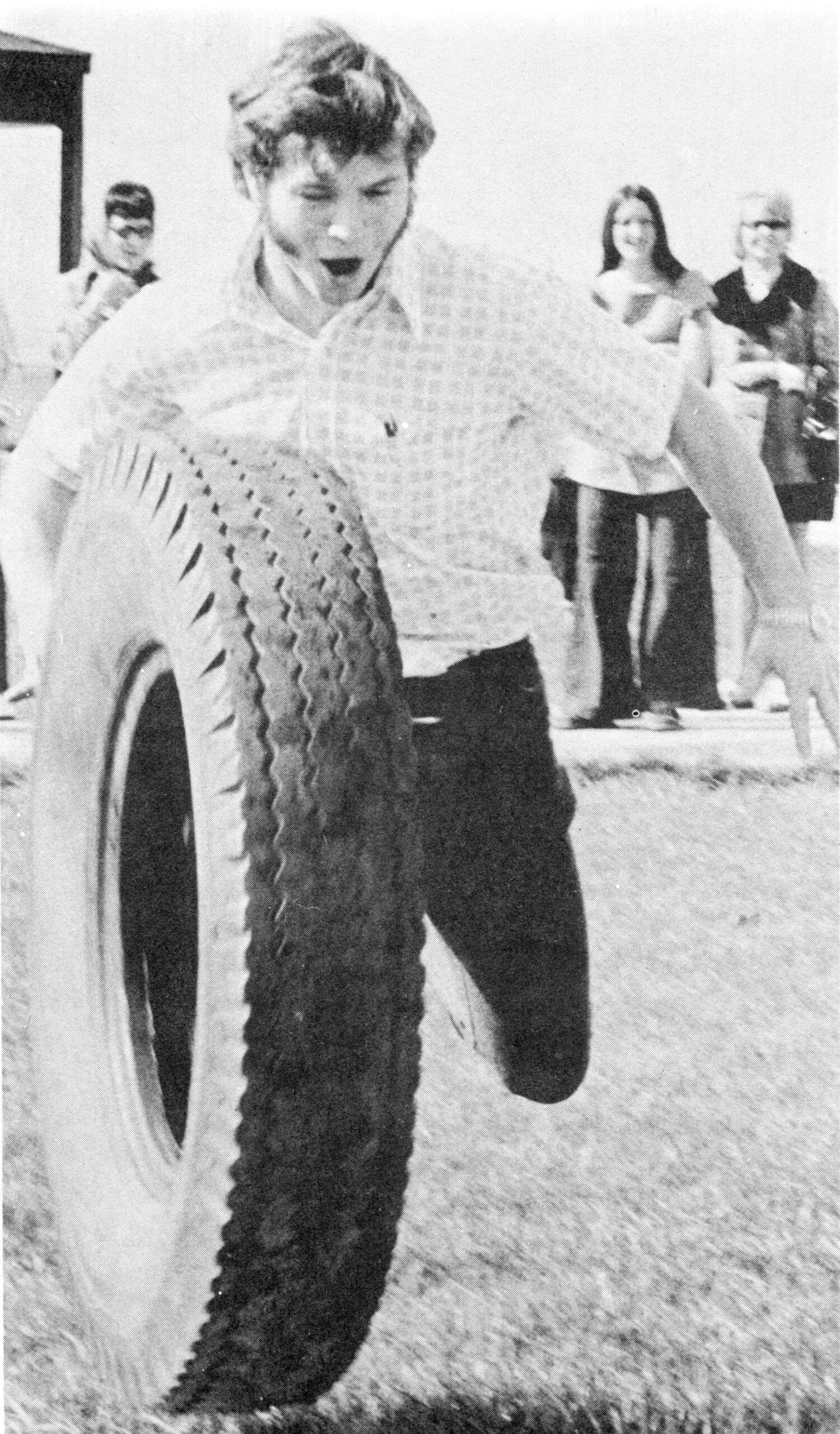 A tire-rolling contest was one of the new events for Spring Fling 1973. [College Archives]